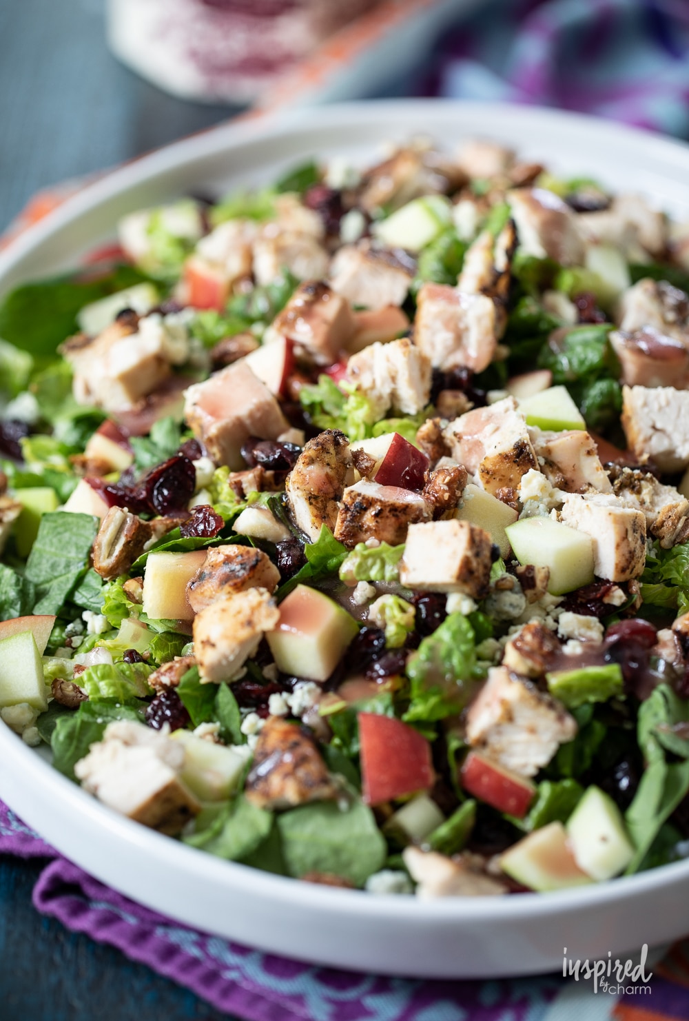 Chicken Apple Pecan Salad with dressing on a large platter.