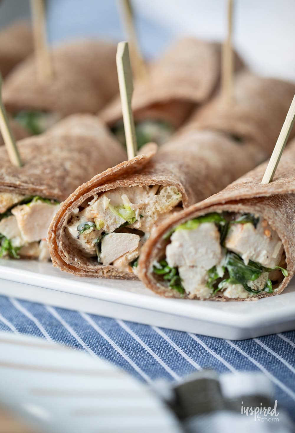 Chicken Caesar Salad Wraps on a white platter.