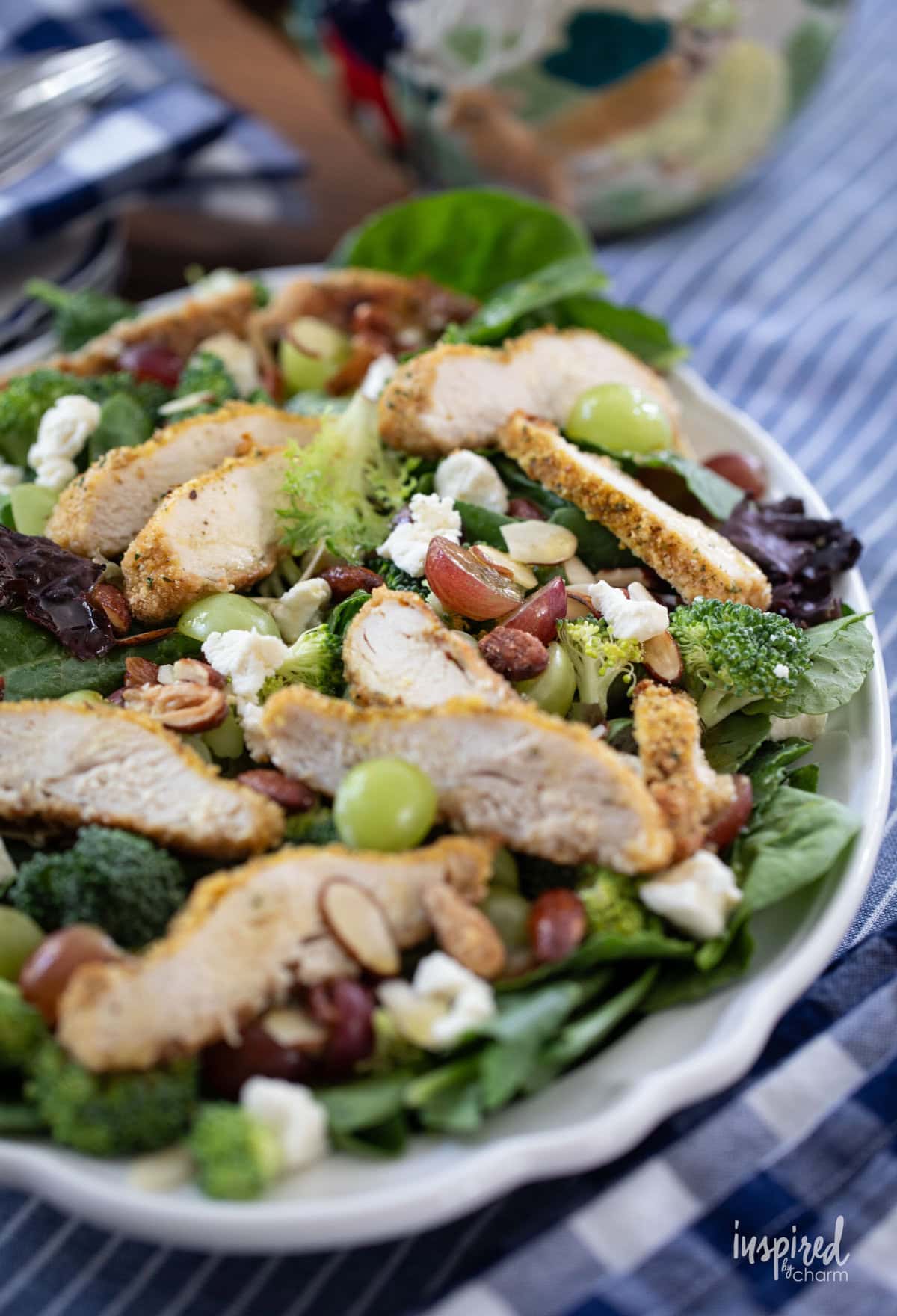 large white platter of Crispy Chicken and Grape Salad.