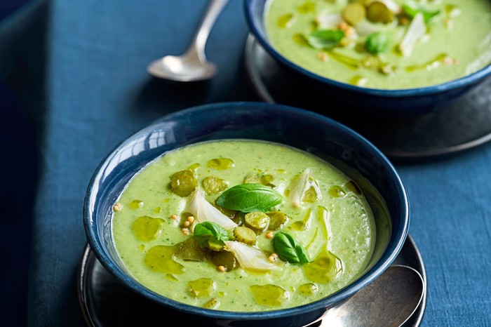 Cucumber-gazpacho Two bowls of cucumber, cornichon and pickled onion gazpacho topped with olive oil and basil