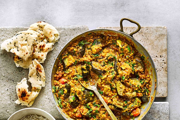 Vegan aubergine curry Vegan Aubergine Curry in a Large Dish with Naan Bread